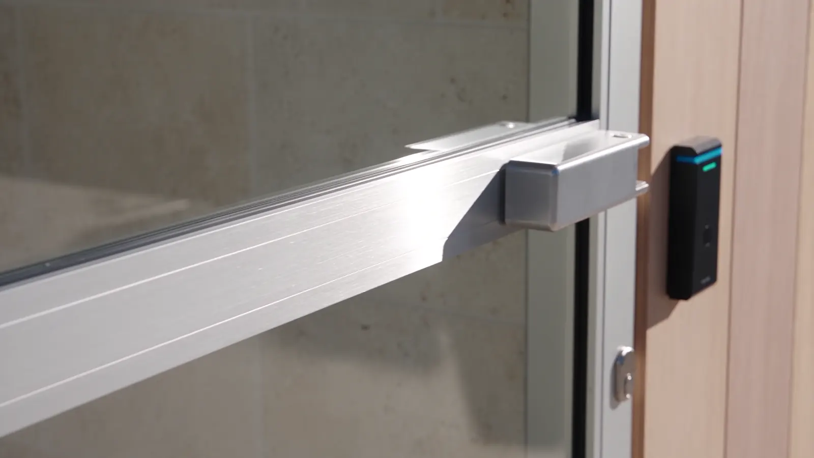 Concept illustration of commercial door hardware and an access reader.